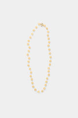 Labro Fiori Limoncello Necklace met gele bloemen op grijze achtergrond