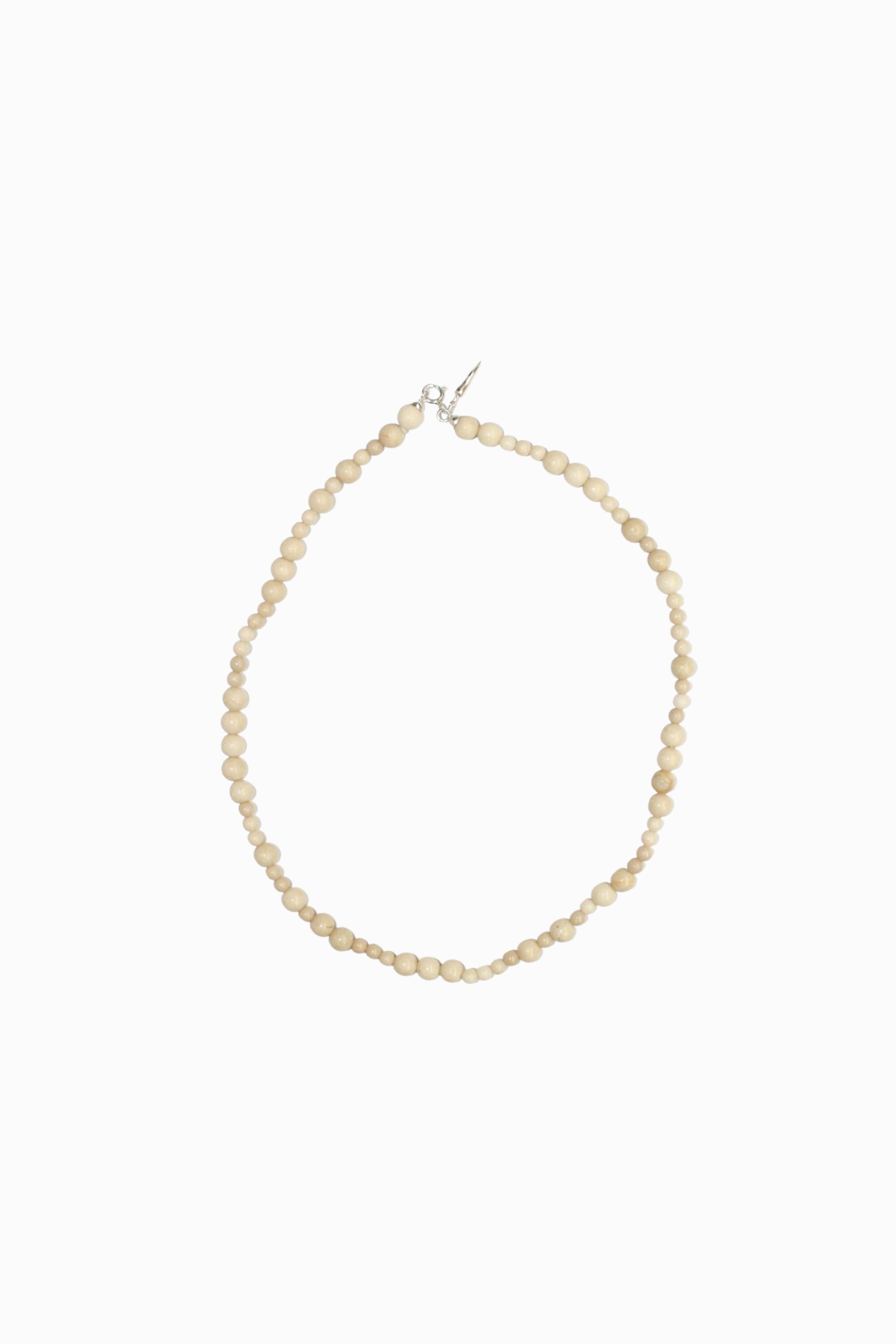 Piccolo White Fossil necklace in matching material; bracelet sold separately